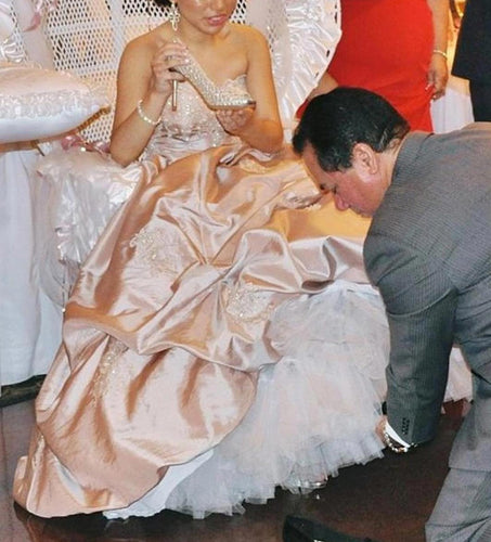 Sweet 16 quinceañera gown featuring lace and sequins